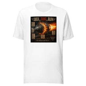 May include: White t-shirt featuring a graphic design with the text "SUCH... BANG... BLOW" above an illustration of a jet engine with fiery details. The design includes additional text and warnings.