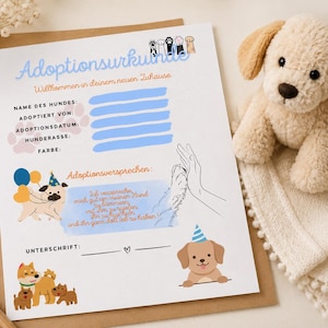 Könnte beinhalten: Ein weißes Papierdokument mit der Überschrift Adoptionsurkunde, das Illustrationen verschiedener Hunderassen, bunte Luftballons, Pfotenabdrücke sowie Felder zum Ausfüllen von Hundedaten wie Name, Datum und Rasse und ein Adoptionsversprechen enthält.