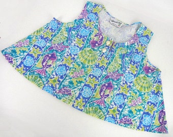 Girls tent top in fish & shell print in blues, greens, mauves with seashell buttons by EnChante Kids size M
