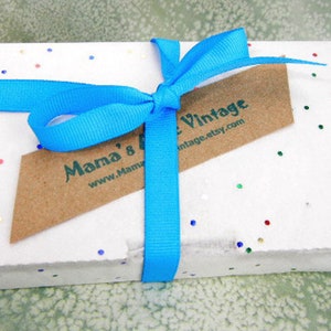 May include: A white gift box with a blue ribbon and a brown tag that says "Mama's Vintage www.Mama'sVintage.etsy.com". The box is covered in small, colorful confetti.
