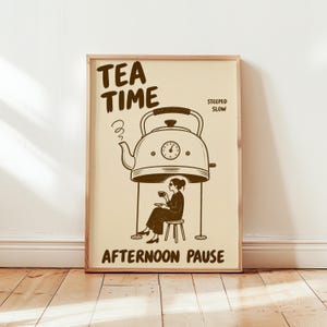 May include: A rectangular wall art print on a cream background featuring dark brown line art of a large kettle hovering over a person sitting on a stool drinking tea. The text reads TEA TIME, STEEPED SLOW, and AFTERNOON PAUSE in dark brown.