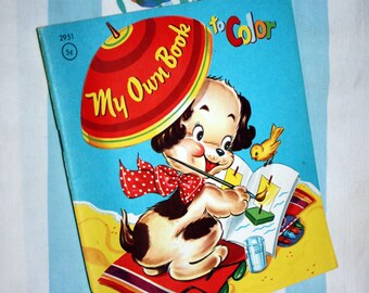 May include: A vintage coloring book with a red, yellow, and green umbrella on the cover. The book features a cartoon puppy holding a paintbrush and a glass of water. The title of the book is "My Own Book to Color".