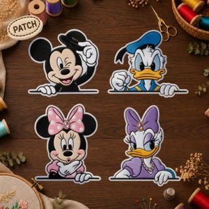 May include: Four embroidered patches featuring Disney characters: Mickey Mouse tipping his hat, Donald Duck with a determined expression, Minnie Mouse blowing a kiss, and Daisy Duck wearing a purple bow and necklace, all shown from the waist up.