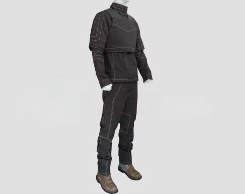 May include: A black long-sleeved shirt with a high collar and a structured chest overlay, paired with matching black trousers. The entire outfit features prominent white contrast stitching along the seams, sleeves, and legs, worn with brown boots.