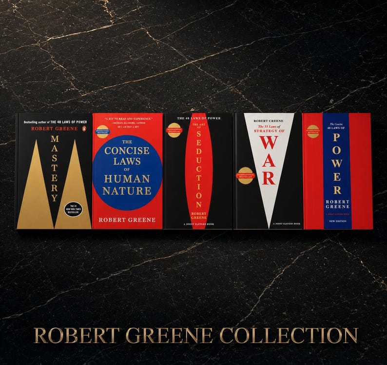 May include: A collection of Robert Greene books, including "Mastery," "The Concise Laws of Human Nature," "The Art of Seduction," "The 33 Strategies of War," and "The 48 Laws of Power." The books have black, red, and white covers.
