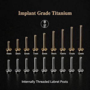 Könnte beinhalten: Eine Sammlung von gold- und silberfarbenen, innen mit Gewinde versehenen Labret-Steckern aus Implantat-Titan. Die Stecker sind nach Längen von 4mm bis 12mm sortiert, mit einem kreisförmigen Einsatz, der das Innengewinde zeigt.