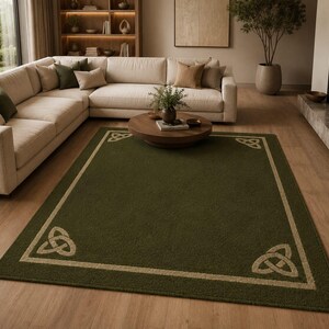 May include: A rectangular area rug featuring a deep olive green center and a contrasting beige border. The rug is decorated with a beige Celtic triquetra knot design positioned at each of the four corners, creating a symmetrical pattern.