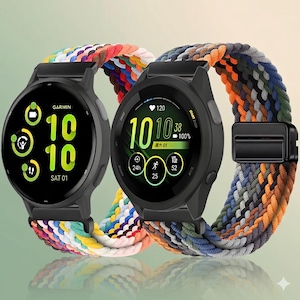 May include: Two Garmin smartwatches with black circular cases and digital displays. The left watch shows the time 10:10 and activity icons. The right watch displays time, heart rate, and battery level. Both feature braided elastic watch bands.