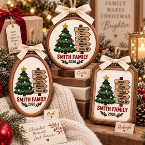 May include: Three custom embroidered Christmas ornaments in circle, oval, and rectangle wooden frames. Each features a green Christmas tree, a signpost with the names James, Olivia, Sophia, William, and Bella, and the text Smith Family 2026.