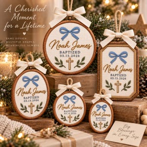 May include: Five wooden embroidery hoop ornaments in round, oval, and rectangular shapes, featuring cream fabric with embroidered blue bows, green leaves, gold crosses, and the text Noah James BAPTIZED 03.15.2026, topped with cream ribbon loops.