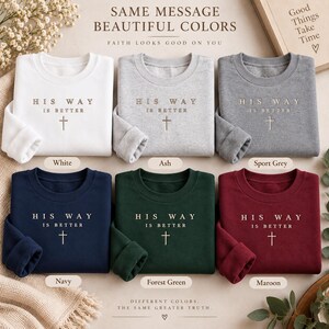 May include: Six crewneck sweatshirts in white, ash, sport grey, navy, forest green, and maroon. Each features the embroidered text 'HIS WAY IS BETTER' above a cross symbol. The text 'SAME MESSAGE BEAUTIFUL COLORS' and 'FAITH LOOKS GOOD ON YOU' appear above the shirts.