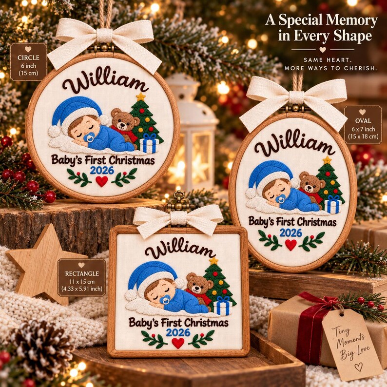 May include: Three wooden embroidery hoop ornaments in circle, oval, and square shapes. Each features embroidered text 'William', 'Baby's First Christmas 2026', a sleeping baby in blue, a teddy bear, and a Christmas tree. Each has a cream ribbon bow.