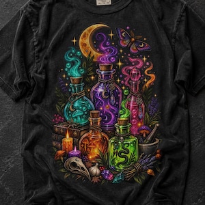 May include: A black t-shirt featuring a vibrant graphic print of multiple glass potion bottles, a crescent moon, a moth, a skull, candles, and various botanical elements. The design includes swirling colorful smoke, crystals, and mushrooms.