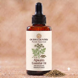 Könnte beinhalten: Eine braune Glas-Tropfflasche mit Oudh Country Purely Essential Ajwain ätherischem Öl. Das Etikett zeigt eine botanische Illustration der Ajwain-Pflanze und Samen sowie den Text 100% Pure & Natural Therapeutic Grade. Ein Haufen Samen liegt daneben.