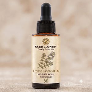 May include: A brown glass bottle with a black dropper cap containing Thyme Essential Oil. The label features the text OUDH COUNTRY Purely Essential, an illustration of a thyme sprig, and the text 100% PURE & NATURAL THERAPEUTIC GRADE.
