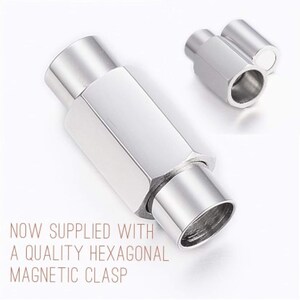 May include: A silver magnetic clasp for jewellery making. The clasp is hexagonal shaped and has a cylindrical design.  NOW SUPPLIED WITH A QUALITY HEXAGONAL MAGNETIC CLASP.