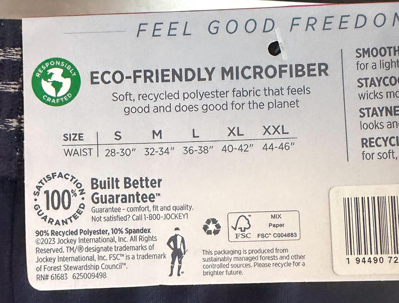 May include: A product tag for Jockey underwear made of eco-friendly microfiber, featuring a size chart for waist measurements from 28 to 46 inches. The tag includes a 100% satisfaction guarantee, material composition of 90% recycled polyester and 10% spandex.