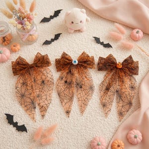 Lazos para el cabello de Halloween: diseños de telaraña, calabaza y ojo.