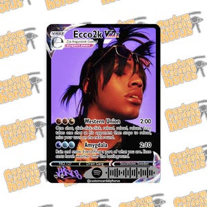 May include: A rectangular trading card featuring a portrait of a person with dark hair and sunglasses against a purple background. The card displays the text Ecco2k VMAX, Western Union, Amygdala, and includes a Spotify code at the bottom.