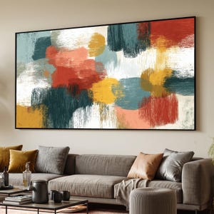 May include: A large rectangular wall art piece featuring an abstract composition of layered brushstrokes in shades of deep teal, burnt orange, mustard yellow, and white. The painting is enclosed in a thin black frame, displaying a textured finish.
