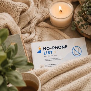 May include: A white rectangular card with the text NO-PHONE LIST, More life, Less scroll, and a blue icon of a smartphone with a diagonal line through it. The card features a small yellow heart and a blue graphic of a rising sun over steps.