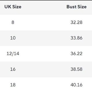 May include: A size chart table with black text on a white background. The columns are labeled Size, UK Size, Bust Size, and Skirt Length. Rows list sizes S through XXL with corresponding UK sizes 8 through 18, bust measurements from 32.28 to 40.16, and skirt lengths from 44.09 to 45.67.