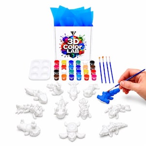 May include: A 3D Color Lab craft kit featuring a white box with blue tissue paper, a white plastic paint palette, twenty small pots of assorted colored paints, four thin paintbrushes, and eleven unpainted white 3D printed animal figures.