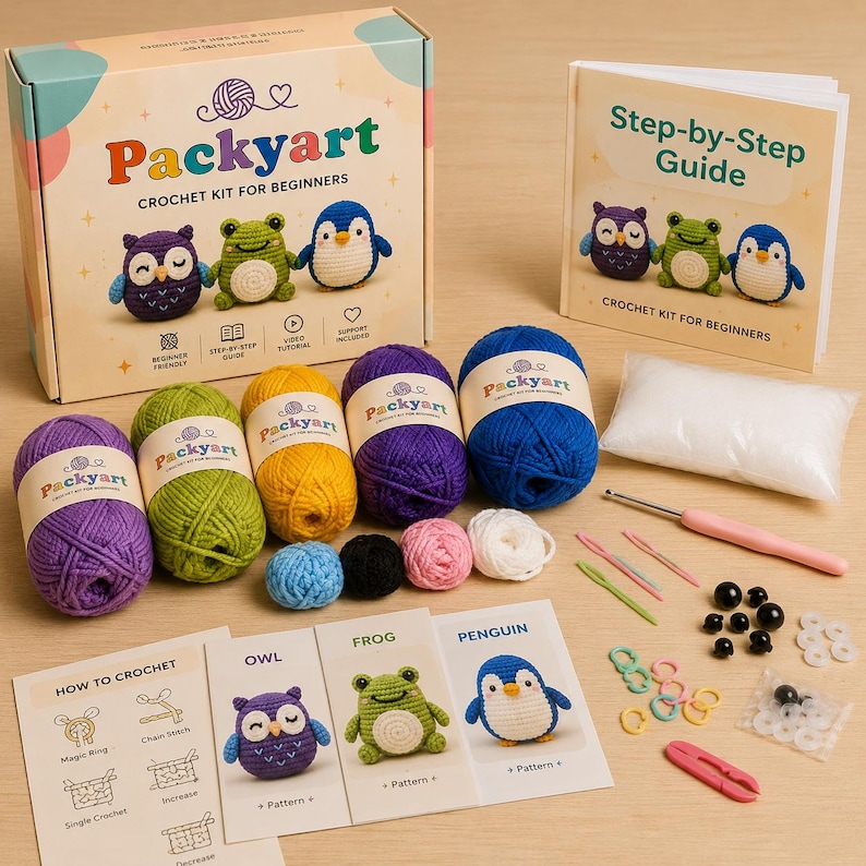 May include: A Packyart crochet kit for beginners, with balls of yarn in various colours, crochet hooks, and accessories. The kit includes a step-by-step guide and instructions for creating an owl, frog, and penguin. The box and guide feature the text "Packyart Crochet Kit for Beginners."