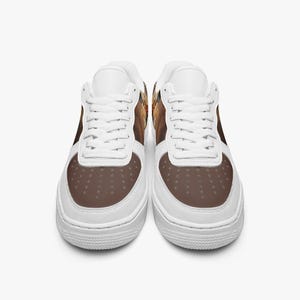 May include: A pair of low-top sneakers featuring a white base with white laces and a brown toe box. The side panels display a detailed graphic print of a dog with brown and tan fur. The shoes have a thick white rubber sole and a perforated toe area.