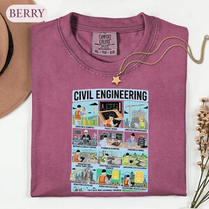 May include: A berry-colored crewneck t-shirt featuring a graphic print titled CIVIL ENGINEERING. The design displays nine illustrated panels depicting various engineering tasks, including surveying, project design, and construction management.