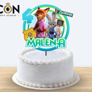 May include: A Zootopia-themed cake topper featuring Nick Wilde and Judy Hopps, a large blue number 4, a Zootopia police badge, and a street sign. The name MALENA is printed in green letters at the bottom, all set against a circular blue and green frame.
