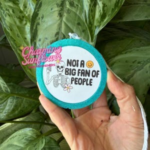 May include: A set of three ceramic mugs with a speckled, matte finish. The mugs are in shades of cream, light gray, and dark gray. Each mug has a simple, minimalist design, perfect for coffee or tea.