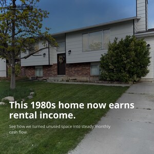 May include: A two-story house with light gray horizontal siding and a red brick lower level. The home features a dark front door with a wreath, multiple windows, and a chimney. Text on the image reads: This 1980s home now earns rental income.