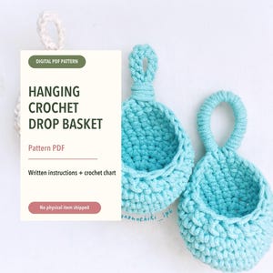 May include: A digital PDF pattern for a hanging crochet drop basket, featuring written instructions and a crochet chart. The image displays two light blue crocheted baskets with circular hanging loops, alongside a white informational card.