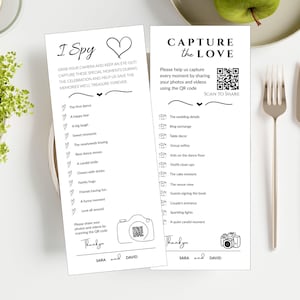 May include: Two white rectangular wedding activity cards with black text and line art. The left card features an I Spy game list with heart icons. The right card is titled Capture the Love and includes a QR code for photo sharing. Both cards are signed Sara and David.