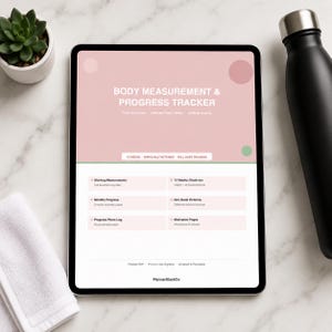 May include: A digital tablet displaying a Body Measurement & Progress Tracker interface with a pink header, white text, and sections for starting measurements, weekly check-ins, monthly progress, non-scale victories, photo logs, and motivation pages.