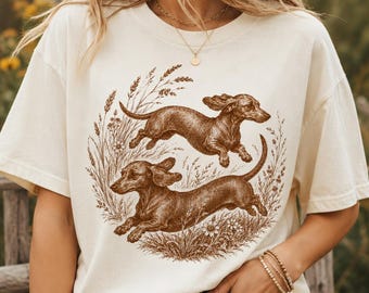 Maglietta vintage con bassotto, maglietta ispirata alla linoleografia, maglietta con bassotto, regali per cani bassotto, abbigliamento per bassotti, maglietta floreale con bassotto, maglietta con bassotto