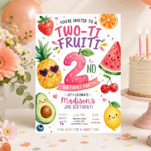 May include: A birthday party invitation card featuring watercolor illustrations of a strawberry, pineapple with sunglasses, watermelon slice, cherries, avocado, and lemon. The text reads: YOU'RE INVITED TO A TWO-TI FRUITI 2ND BIRTHDAY PARTY! LET'S CELEBRATE MADISON'S 2ND BIRTHDAY! SATURDAY AUGUST 16TH 2:00 PM MADISON'S HOUSE 123 FRUIT LOOP SAN ANTONIO, TX 78212 RSVP TO MOM 210-555-1234 COME READY FOR A SWEET TIME!