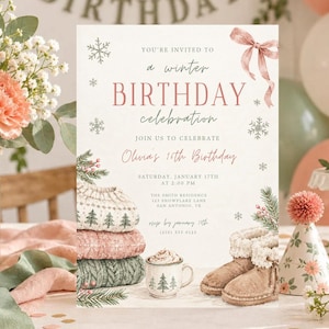 May include: A winter birthday invitation card featuring a pink ribbon, snowflakes, a stack of three patterned jumpers, a mug of hot cocoa, and tan winter boots. The text reads: You're invited to a winter birthday celebration, Olivia's 16th Birthday.