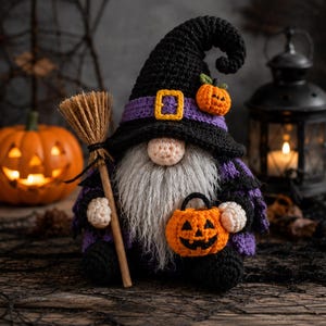 May include: A crocheted gnome wearing a tall black pointed hat with a purple band and a yellow buckle. The gnome has a long gray beard, a small peach-colored nose, and holds a miniature broom and a small orange crocheted jack-o'-lantern bucket.