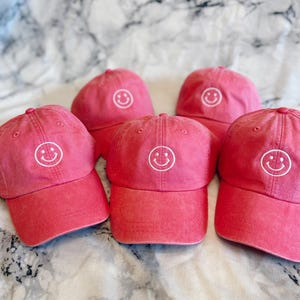 Embroidered Smiley Face Hat with leather strap and brass embroidery