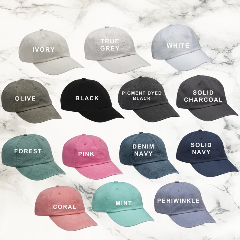 a collection of various colored baseball caps arranged in a grid-like pattern.