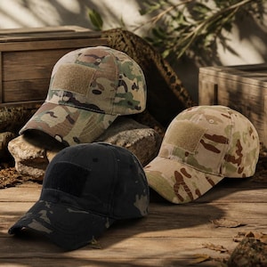 May include: Three baseball caps featuring a structured crown and a curved brim. Two caps display a multi-colored camouflage pattern in shades of green, brown, and tan, while one cap is solid black. Each cap includes a rectangular hook-and-loop patch.