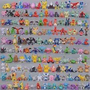 May include: A large collection of small, colorful plastic figurines representing various creatures, arranged in neat rows on a plain gray surface. The figures feature diverse shapes, sizes, and colors, including yellow, blue, pink, and green, depicting distinct characters.