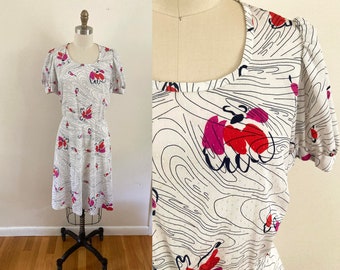 adorable vintage 1950s 1960s patterned dress / swing white dress with abstract swirls in red, pink, and purple / short sleeve midi dress