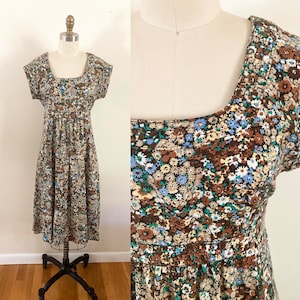 vintage 1970s ditzy floral dress / small to medium patterned fit and flare empire waist dress / short sleeve cotton dress / Jonathan Logan