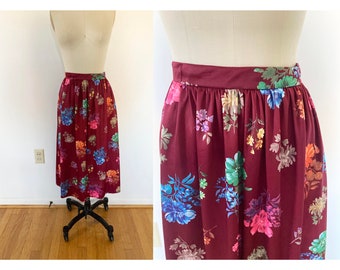 small to medium vintage 1970s floral skirt / midi skirt / high waisted a-line skirt with colorful flowers /