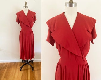 medium to large vintage 1950s red day dress / crepe wrap dress with shawl collar and pleated skirt / short sleeve midi dress