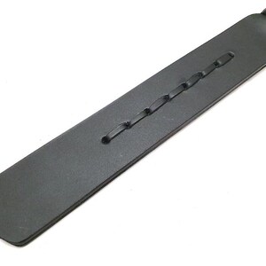 Premium handcrafted leather paddle made with black genuine leather and a smooth wooden handle. Features decorative braided leather details and expert craftsmanship. Handmade leather accessory, artisan leatherwork, custom leather paddle, leather gift idea, traditional leather craft, rustic leather decor, high quality handmade product, leather artisan creation, durable leather tool, unique handcrafted accessory.