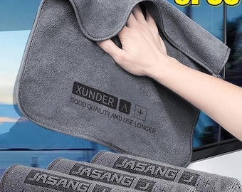 May include: A set of five gray microfiber cleaning cloths with rounded corners. The cloths feature the text XUNDER A + GOOD QUAILITY AND USE LONGER or JASANG J + feel life feel love. The top cloth is held up, while four others are rolled below.